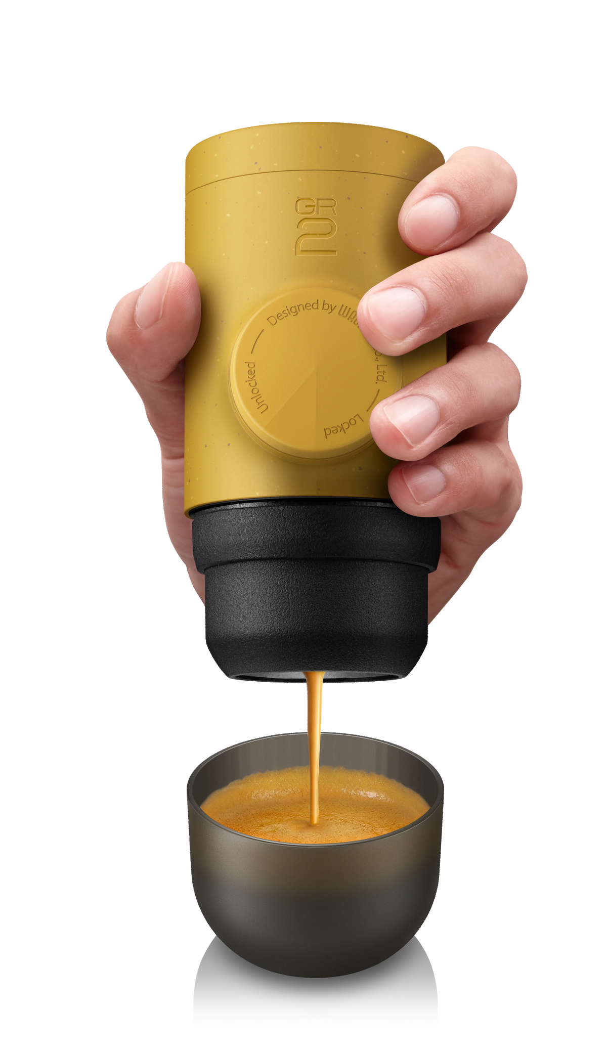 Hand holding a yellow portable coffee maker pouring coffee into a small cup on a transparent background