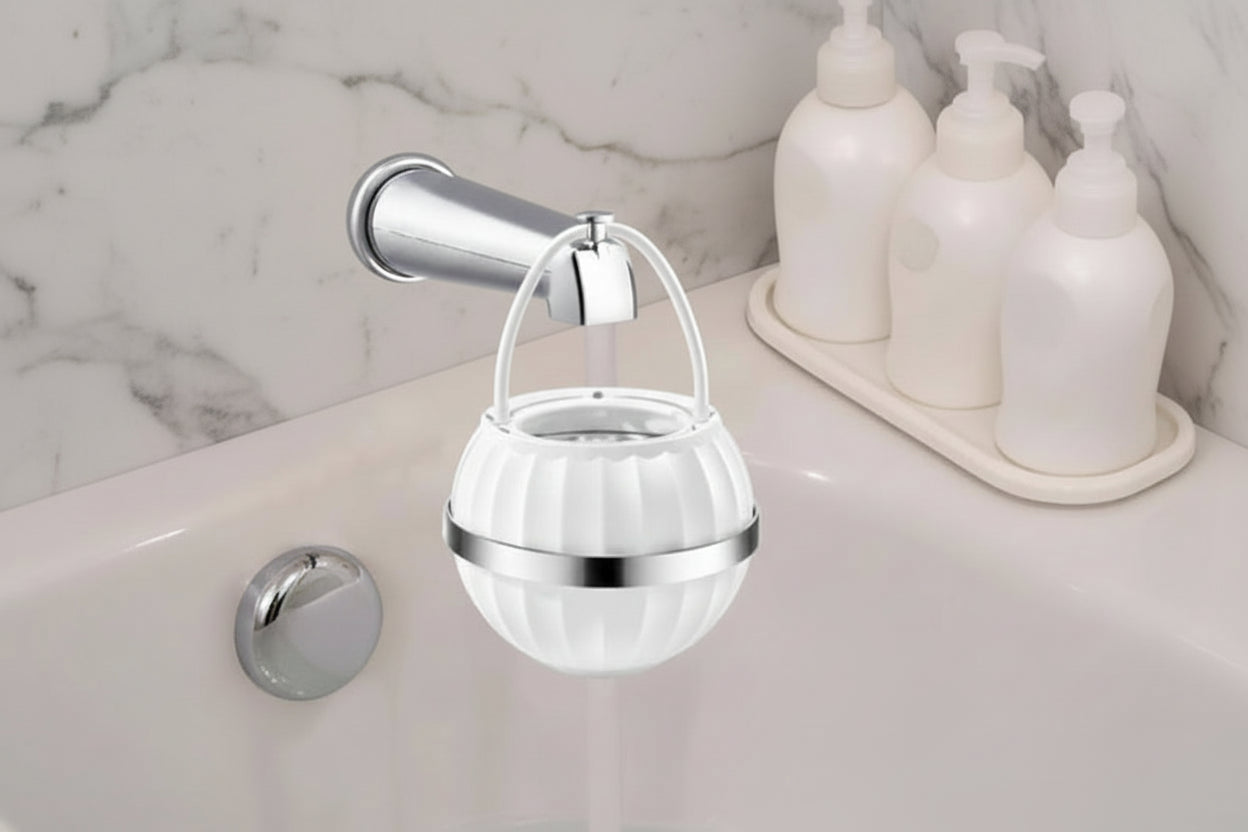 Premium bathtub water filter attached to a bathtub faucet with marble background