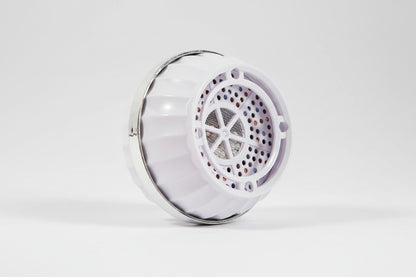 Premium bathtub water filter laying on its side on a studio background